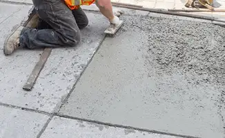 Professional repairing a concrete floor in Louisville, KY