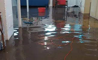 Basement with boiler, cabinets and washing machine completely flooded in Louisville, KY